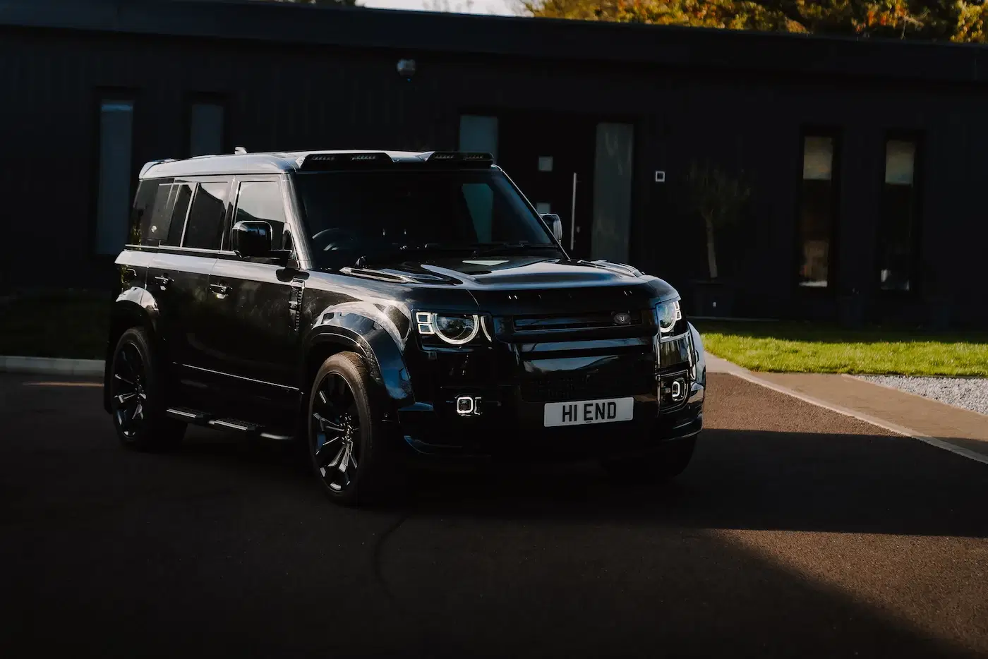 Front of Land Rover Defender 110 available for self-drive hire and chauffeur driven hire in Home Counties
