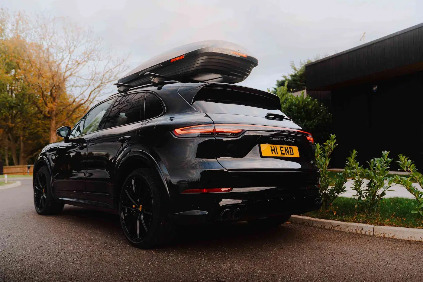 Black luxury SUV with roof box