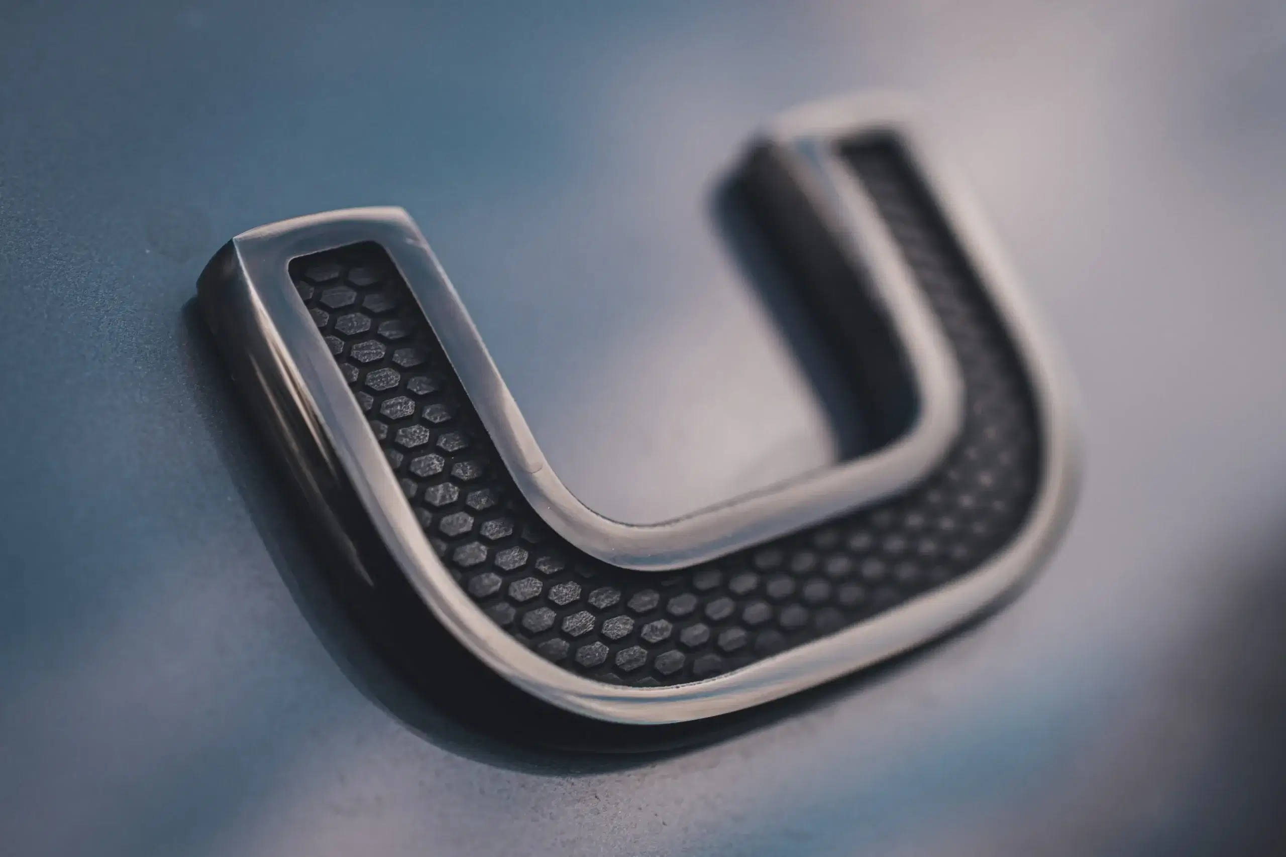 Close-up of a metallic letter U