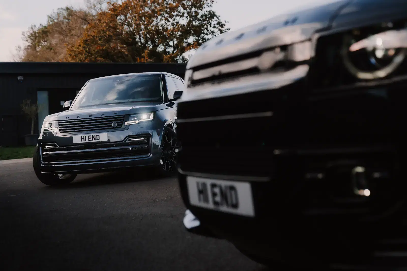 Two luxury cars with customised plates