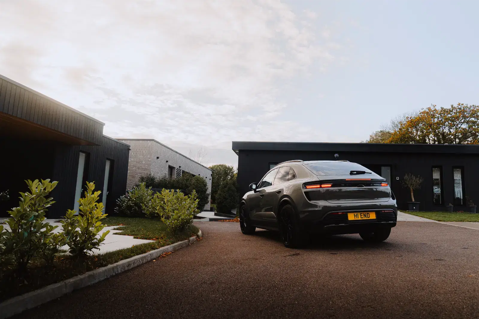 Sleek car outside modern architecture.